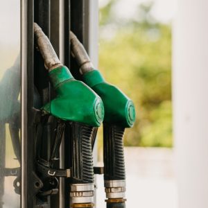 green,fuel,pump,nozzles,at,gas,station,for,vehicles,refueling