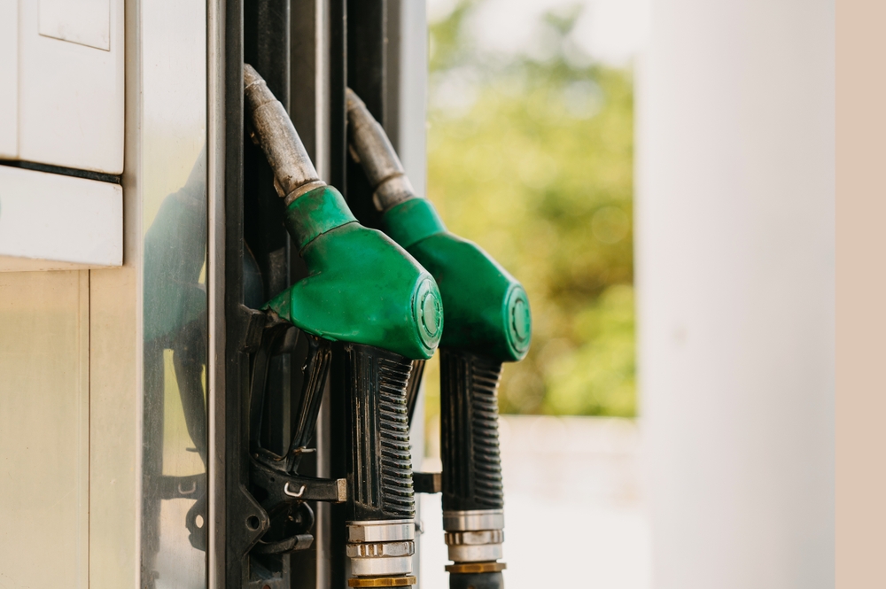 green,fuel,pump,nozzles,at,gas,station,for,vehicles,refueling